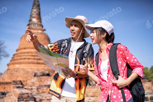 Preview: Traveler tourist man and women with backpack walking in historical place temple Ayuttaya Thailand