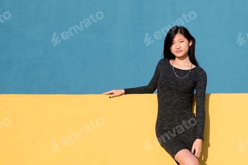 Preview: smiling asian woman in a tight dress