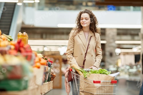 Preview: Young Woman Shopping in Supermarker