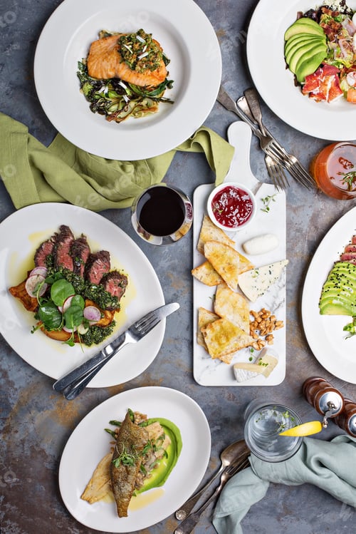 Preview: Big dinner table overhead view with steak and fish