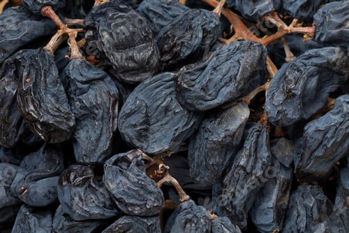 Preview: Dried grapes on the vine close up full frame
