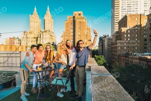 Preview: Group of friends having party on a rooftop