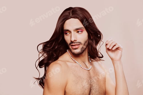 Preview: Drag queen wearing makeup and wig posing at studio