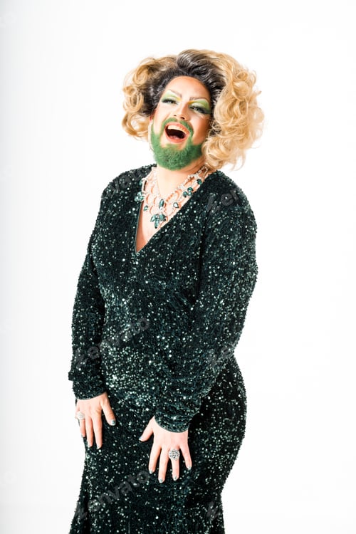 Preview: Happy drag queen in a dark green dress with green beard