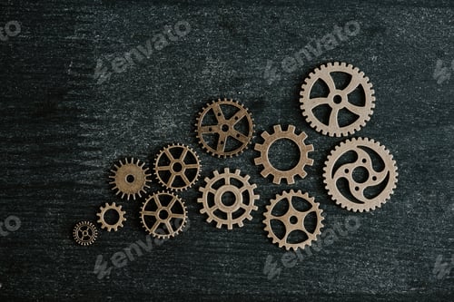 Preview: top view of retro metal gears on dark wooden background