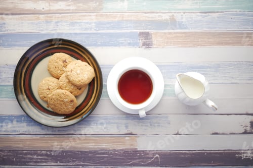 Preview: Close up of cookies and tea on table