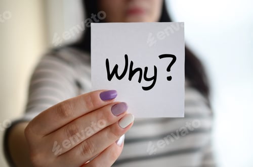 Preview: Young sad girl shows a white sticker. Caucasian brunette holding a sheet of paper with message. Why?