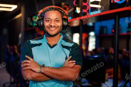 Preview: Handsome gamer satisfied with game in computer club