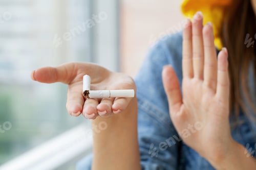 Preview: Stop smoking, close up of woman breaking cigarette