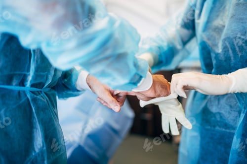 Preview: Dental surgeon prepares to perform an operation