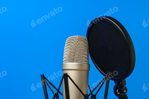 Preview: Professional microphone stand over blue studio background