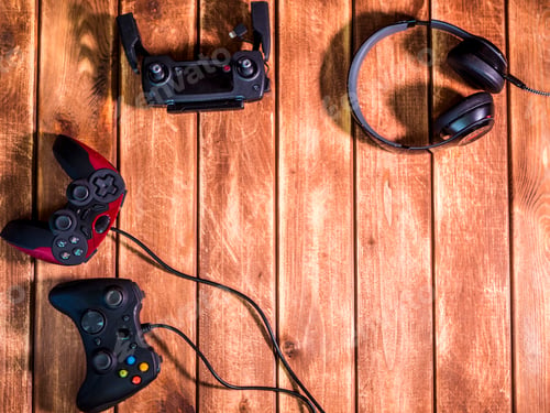 Preview: video gaming devices kit on the wooden table copy space