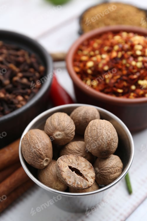 Preview: Different aromatic spices on white table, closeup