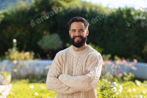 Preview: Portrait of happy caucasian man with beard smiling to camera in garden