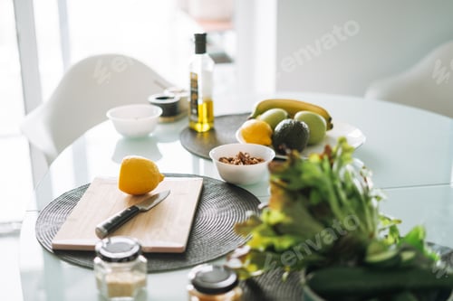 Preview: Fresh green healthy fruits and vegetables on table while cooking in kitchen at home