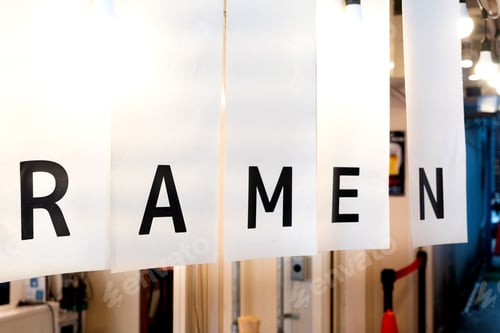 Preview: White noren curtain with bold black letters spelling "RAMEN," hanging at the entrance ramen shop.