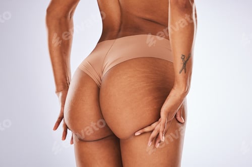 Preview: Cellulite, ass and underwear with a model black woman in studio on a gray background for body posit