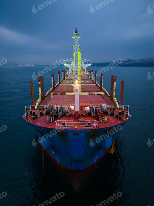 Preview: Aerial view cargo bulk carrier ship on the sea at night