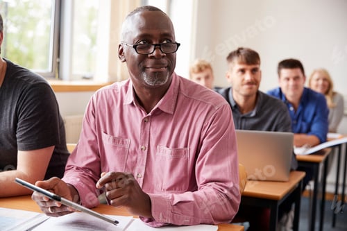 Preview: Mature Student Using Digital Tablet In Adult Education Class