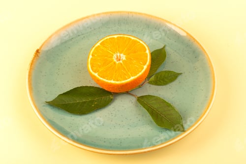 Preview: a front view orange slice fresh juicy mellow ripe with green leaf inside glass plate isolated on the