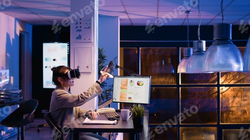 Preview: Female entrepreneur working at night with vr glasses