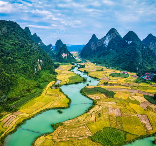 Preview: Phong Nam Valley with rice field and river flows through traditional village in countryside