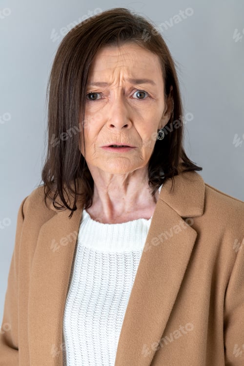 Preview: Annoyed senior woman in a blazer