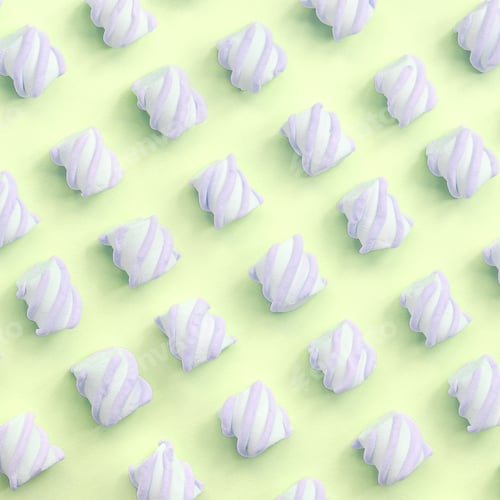 Preview: Colorful marshmallow laid out on lime paper background. pastel creative textured pattern