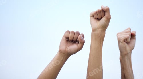 Preview: We know our rights. Unrecognisable demonstrators holding up their fists in protest.