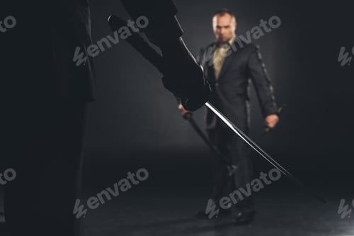 Preview: handsome modern samurai in suit ready to fight on black