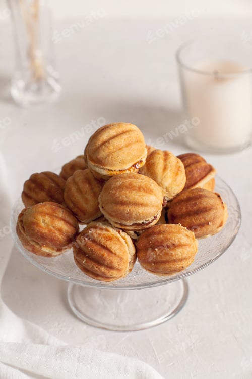 Preview: Russian traditional homemade cookies Nuts with condensed milk on a glass stand