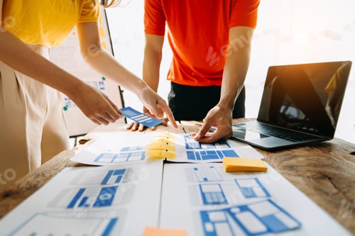 Preview: UX developer and ui designer brainstorming about mobile app interface wireframe design with