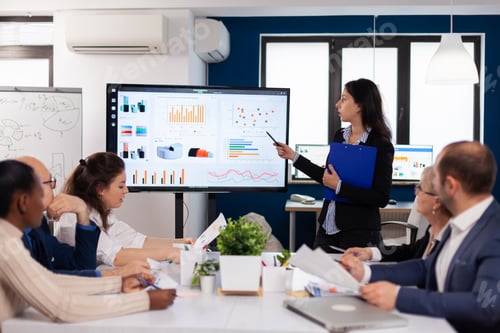 Preview: Young team leader in big corporation briefing coworkers