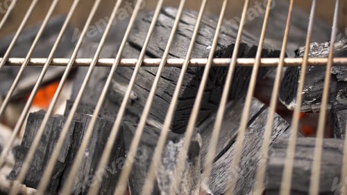 Preview: Glowing Hot Charcoal In BBQ Grill Pit With Flames, Close-up. Burning coals close up