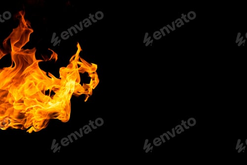 Preview: Close up of yellow and orange flames and copy space on black background