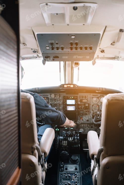 Preview: Faceless pilot flying modern aircraft