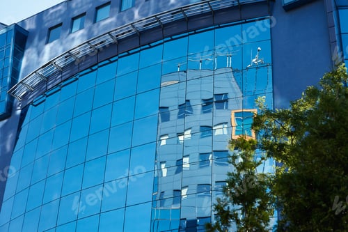 Preview: Modern office building with green trees