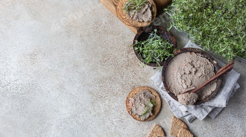 Preview: Homemade meat or chicken liver pate with multigrain crackers and microgreen