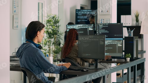 Preview: Asian software programer writing code on computer