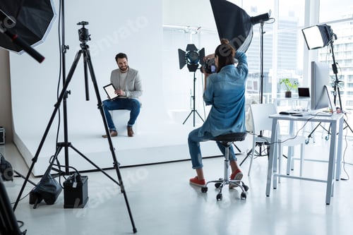 Preview: Male model posing for photographer