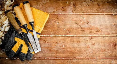 Preview: Chisels with wooden sawdust on the table.