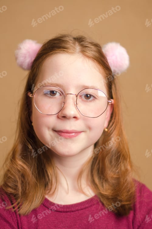 Preview: Portrait of a beautiful red-haired girl in eyeglasses