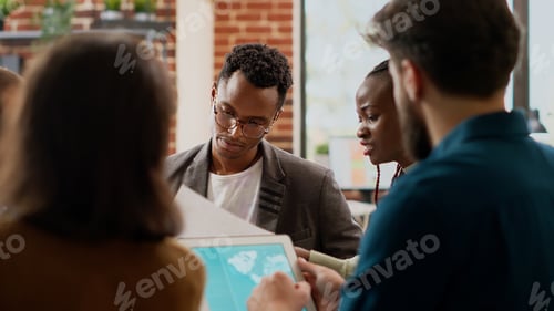Preview: Diverse group of coworkers planning data presentation