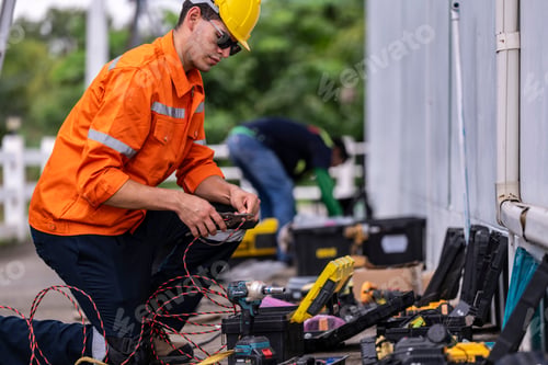 Preview: A skilled technician prepares electrical wiring with precision.