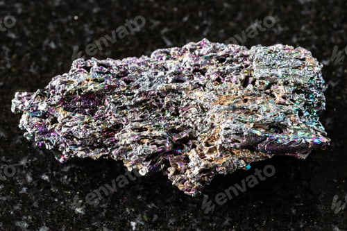 Preview: sample of raw carborundum mineral on black granite