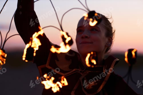 Preview: Smiling Woman Dancing with Flaming Fans Performing in Fire Show