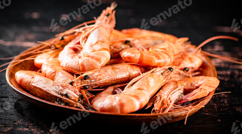 Preview: Boiled shrimp in a wooden plate.