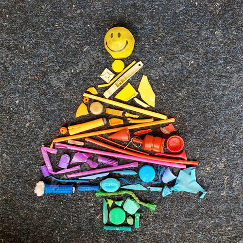 Preview: Rainbow colour tree shape made with found objects plastic pollution from the beach
