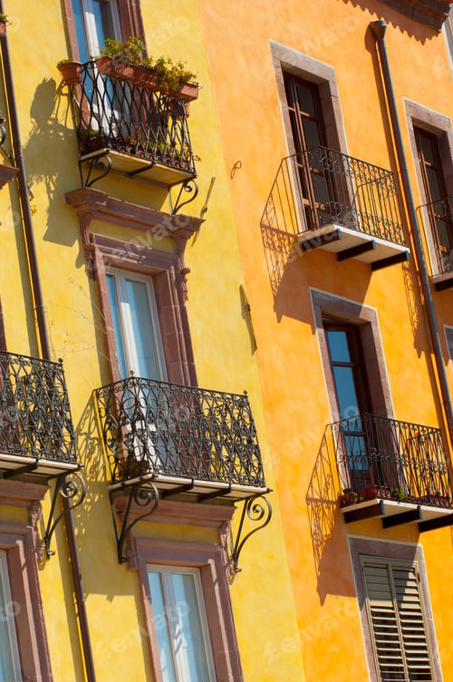 Preview: Detail of yellow house facade with balconies, Sardinia, Italy