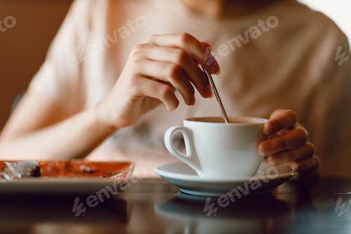 Preview: Young beautiful smiling woman enjoying drinking cappuccino coffee cup indoor cafe.